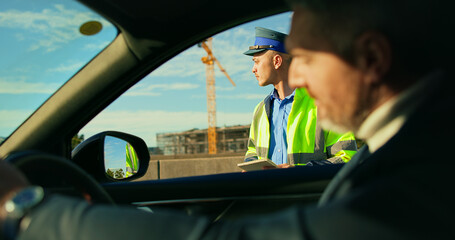 Car, policeman and fine for driver, city and punishment for traffic violation, public safety or...