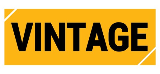 VINTAGE text on yellow-black grungy stamp sign.