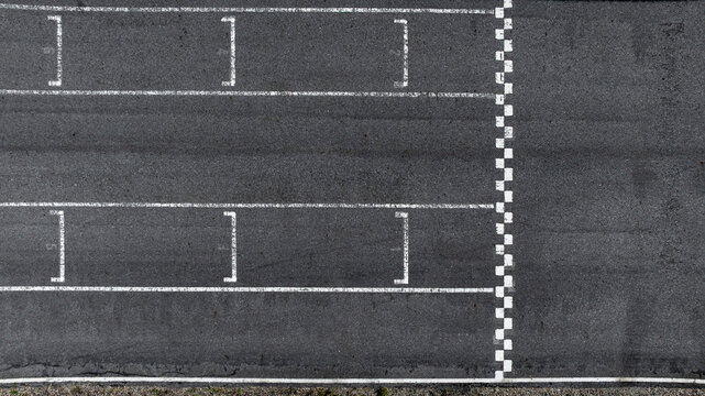 Start and Finish motor race line asphalt on grand prix street circuit, Checkered line on racing motorsport race track, Auto or automobile background concept.