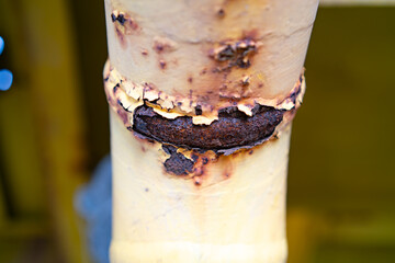 Close-up of corroded steel pipe, corrosion of steel, general corrosion, offshore petroleum pipelines.