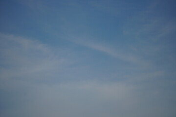 Patches of white clouds in the blue sky