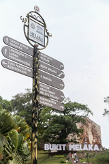 Signpost of Melacca city under overcast sky
