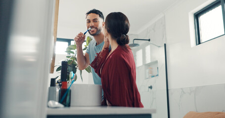 Brushing teeth, love and morning with couple in bathroom of home together for dental hygiene. Oral...
