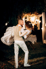 Obraz premium newlyweds at a wedding of sparklers