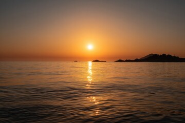 Obraz premium Golden sunset over calm ocean. Silhouette of distant land