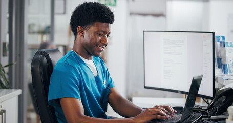 Black man, nurse and typing with laptop for online booking, administration or medical appointment....