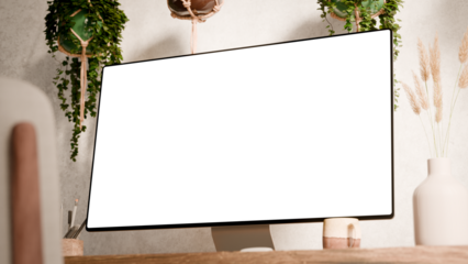 Computer monitor with blank screen mockup on a wooden desk - modern workspace in boho style surrounded by hanging plants and minimalist decor - Right Bottom Middle Perspective