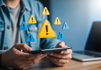 Digital Alert: An individual navigates their device as digital hazard symbols float, representing the risks and warnings inherent in the modern digital landscape. Emphasizing awareness, safety.