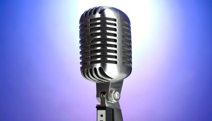 Close-up of vintage microphone against gradient backdrop