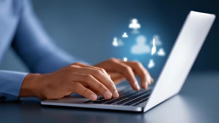 Hands actively typing on laptop while digital user group icon appears above. Focused workspace at home or office environment. Concept of technology, online community, business growth - Powered by Adobe