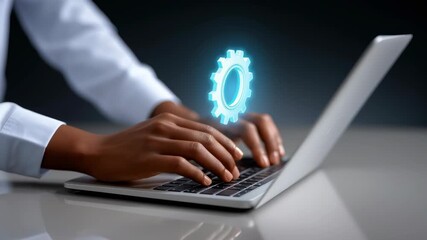 Hands navigating keyboard while a large cogwheel graphic overlays screen. Clean modern workspace enhances concentration and productivity. Concept of digital innovation, technology development, IT - Powered by Adobe