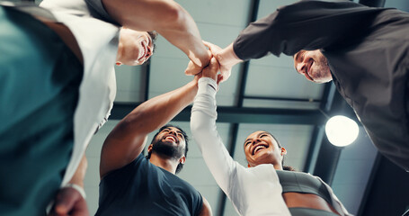 Exercise, team or hands together in support at gym for training success, achievement or workout. Low angle, people and happy with celebration at sports club for wellness progress or fitness community © peopleimages.com