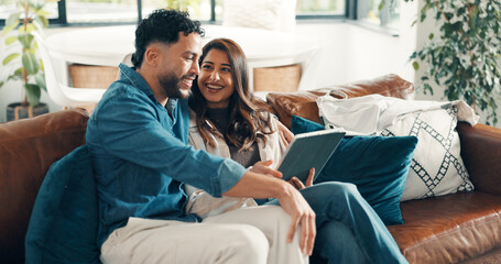 Obraz premium Happy, couple and relax with tablet at house for social media, reading funny meme and bonding. Smile, people and digital for streaming film, comedy movie and entertainment subscription in living room