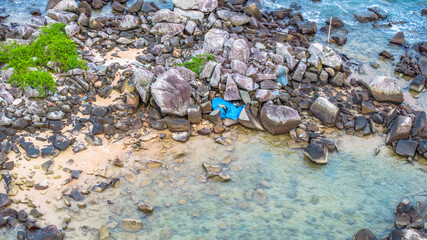 July 5 2025 Coastal Beach with Clear Water and Rock Formations in Natural Setting