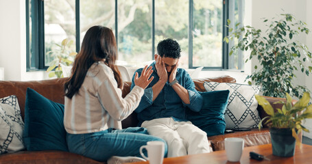 Couple, living room and argument with anxiety, stress and drama in home or apartment. Frustrated,...