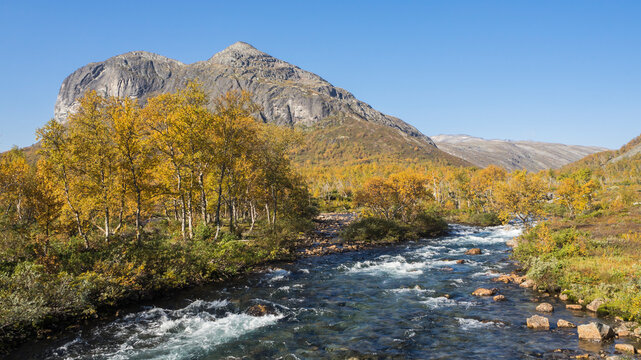 Autumn landscape with mountain and stream in Jotunheimen national park Norway