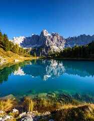 Obraz premium Mountain lake reflection, autumn scenery, Alps