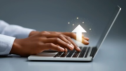 Hands typing quickly on laptop keyboard in modern workspace. Subtle arrow overlay suggests growth and progression. Concept of technology, digital marketing, online business - Powered by Adobe