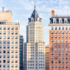 Fototapeta premium Colorful Urban Skyline under Clear Blue Sky