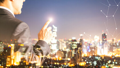Professional Technician Interacting with Digital Touch Interface at Night