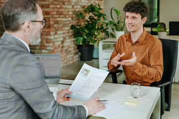 Candidate and manager in job interview at office workspace
