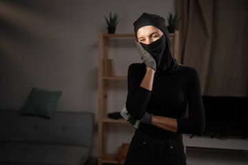 Dental problems. Female robber or burglar pressing sore cheek, suffering toothache