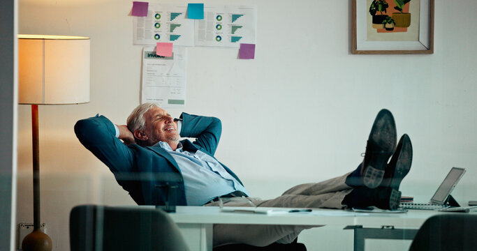 Stretching, relax and mature business man finish financial analysis for trading or project. Calm, waiting and happy stock broker in office with complete work for investment, break or feet up for rest