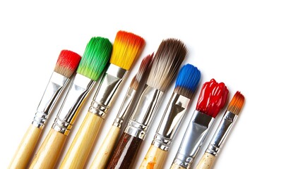 Row of colorful paintbrushes loaded with vibrant paint against clean white background studio shot