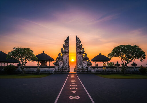 The iconic 'Gates of Heaven' at Lempuyang Temple in Bali, Indonesia, framing a breathtaking sunset over the horizon.