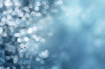 Abstract blurred background of light-blue and silvery bokeh circles