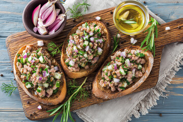 Bruschetta with minced meat cucumber onion and herbs