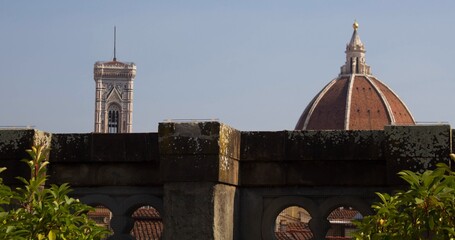 2022.07.21 Florence, Italy, Cathedral of Santa Maria del Fiore, evocative image of part of the dome and its bell tower
