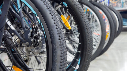 Obraz premium Close-up of many bicycles standing in a row in a sporting goods store