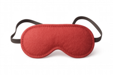 Soft red eye mask lying on clear surface, symbolizing peaceful slumber and restful nighttime comfort