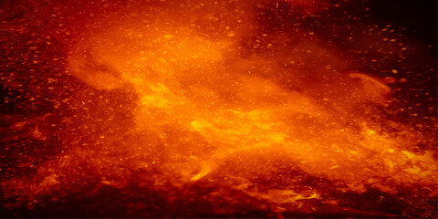 Abstract inferno with motion-blurred flames in a fiery orange and red smoke-filled sky