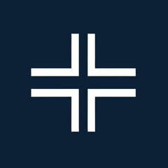 Obraz premium Abstract white geometric cross symbol with Lshaped arms.