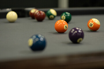 A series of background images of a pool table with balls and a cue.