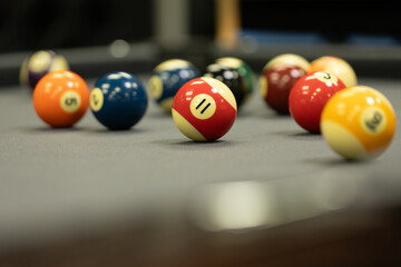 A series of background images of a pool table with balls and a cue.
