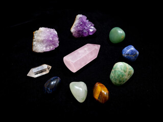 Assortment of Healing Crystals on Black Background for Meditation and Spiritual Practices Various Shapes Sizes and Colors Ideal for Wellness