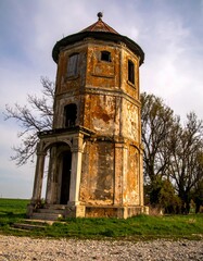 Old weathered tower in a rural landscape
