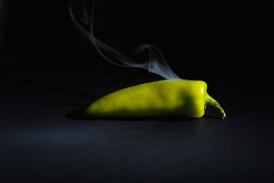 Sri lankan Fresh Hot and Smoky Green Capsicum (Chili Pepper) isolated on Black Background &ndash; Spicy Food Concept