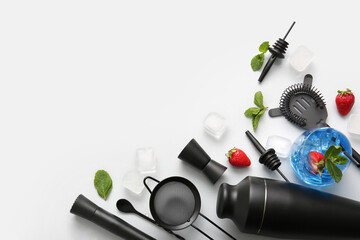 Composition with bartender utensils, glass with tasty cocktail and ingredients on white background