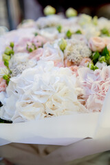 A bouquet of delicate white roses for a wedding ceremony.