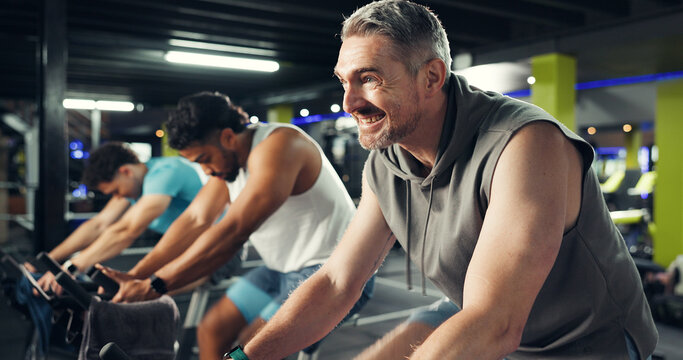 Spin class, exercise and people in gym on bicycle for fitness, cardio workout and intense training. Sports center, cycling and men on stationary bike for endurance challenge, health and wellness