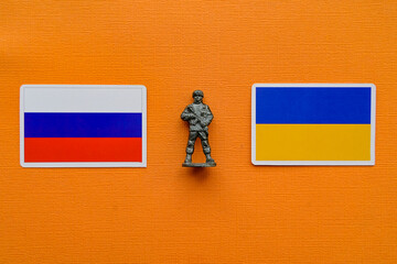 Flags of Russia and Ukraine on a yellow background. The Russian-Ukrainian conflict.