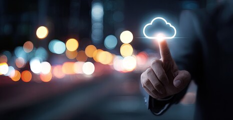 Businessperson touching a glowing cloud icon over a cityscape at night