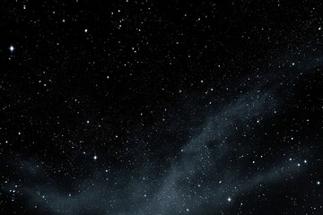 Obraz premium Deep space filled with scattered stars and a hazy nebula