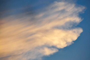 Beautiful storm clouds on a summer night with pinks and blues.