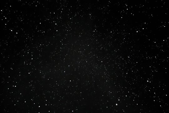 A vast expanse of black night sky, densely speckled with numerous small, white stars