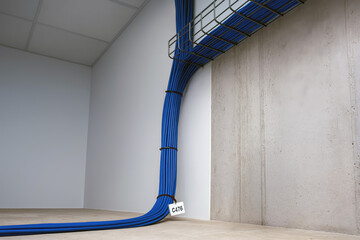 Organized network cables in data center wall conduit